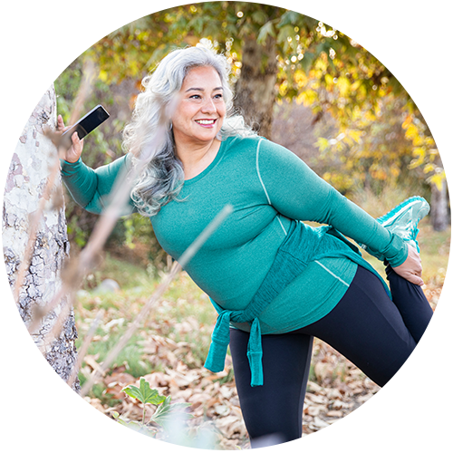 Female in the park stretching before exercise