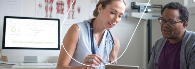 Doctor with patient showing information on a tablet