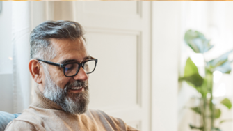 Man looking at phone and smiling