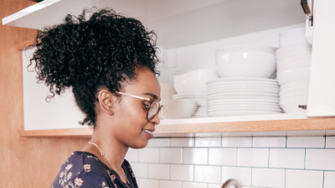 Lady organising her kitchen