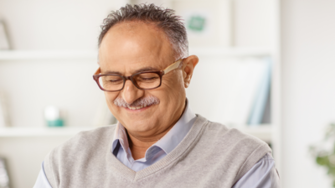 Man using phone and smiling