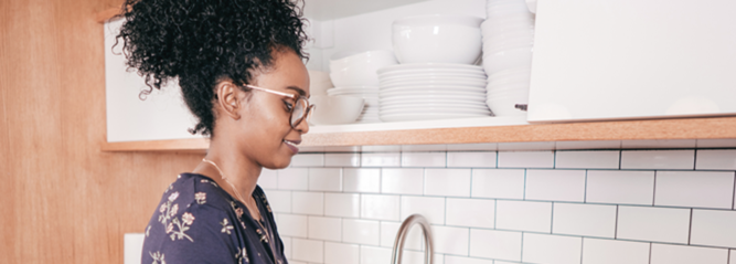 Lady organising her kitchen